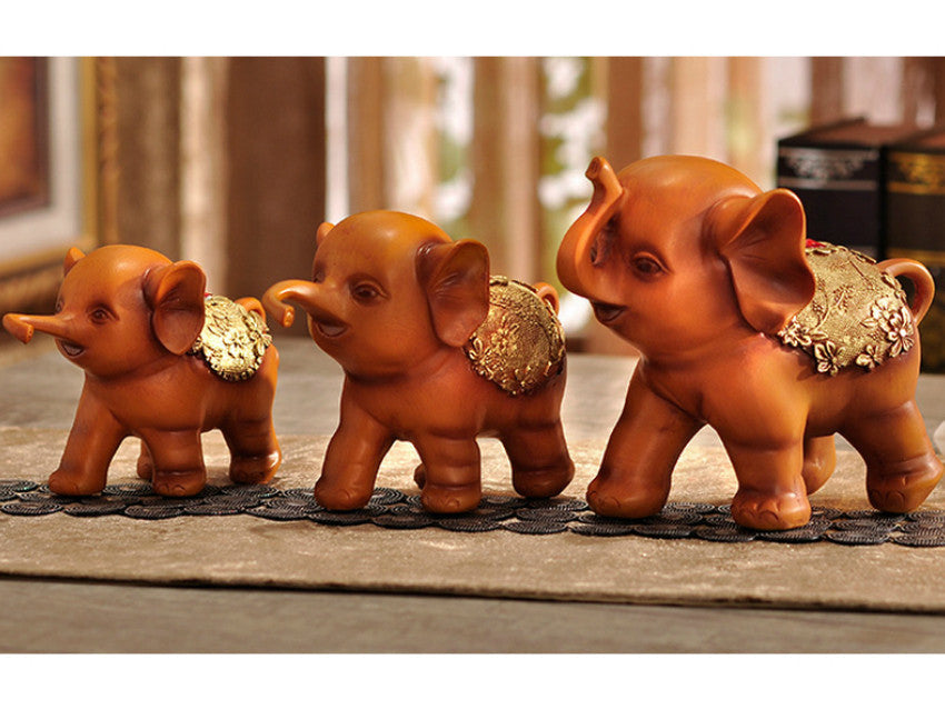 Brown resin elephant family of three figurine sculpture.