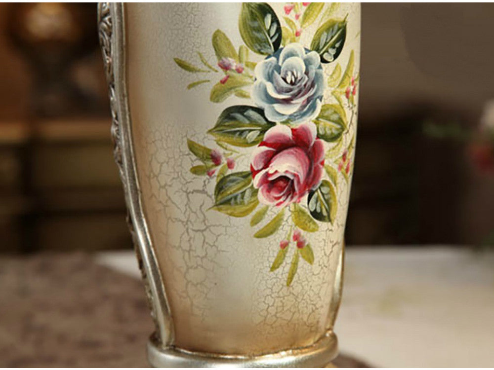 Tall vintage resin vase hand-painted with flowers, 21 inches high.