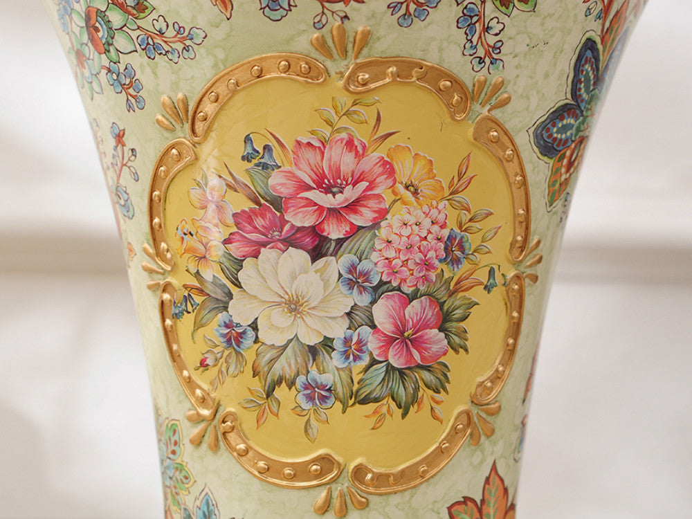 Vintage gold rim ceramic vase with hand-painted flowers.
