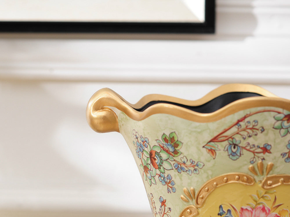 Vintage gold rim ceramic vase with hand-painted floral design.
