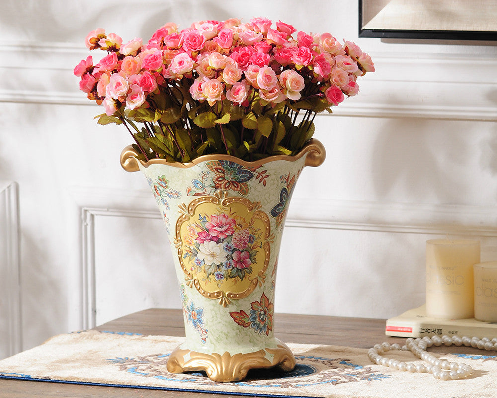 Vintage gold rim ceramic vase with hand-painted flowers.