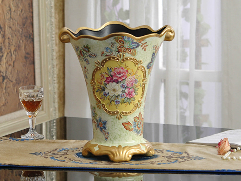 Vintage gold rim ceramic vase with hand-painted flowers.