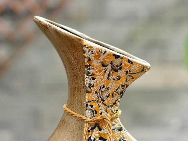 Antique brown broad resin vase with floral decor, part of vintage collection.