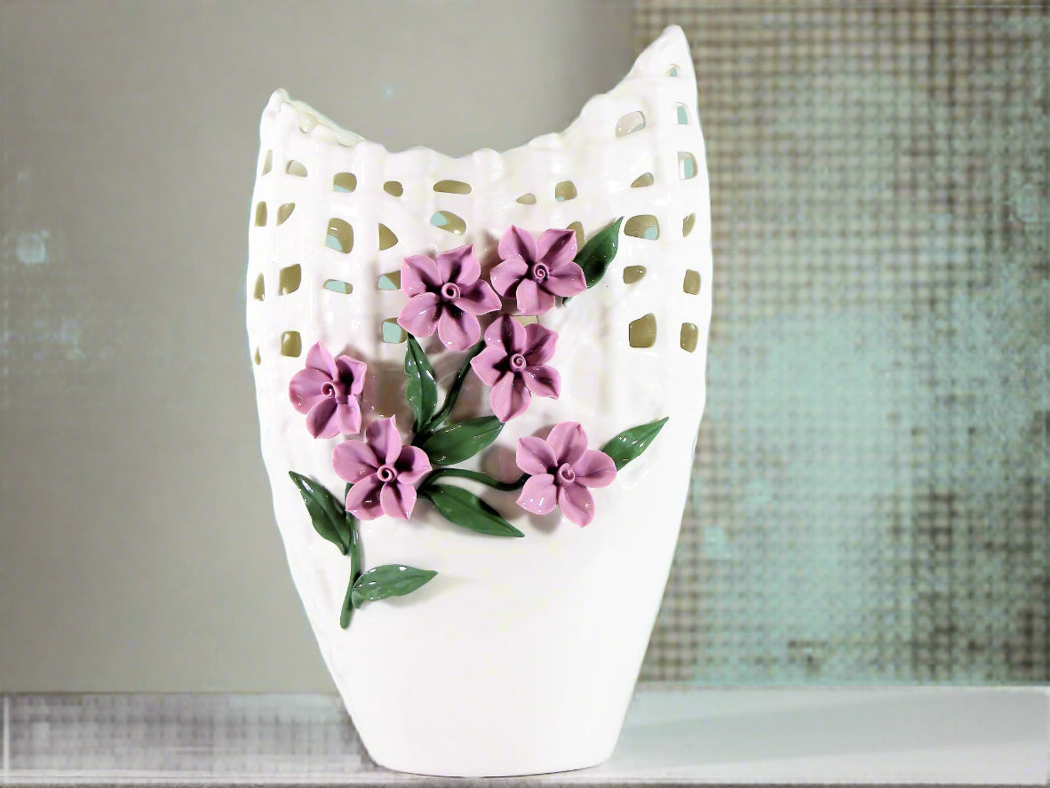 Tall white porcelain vase with pinched purple flowers