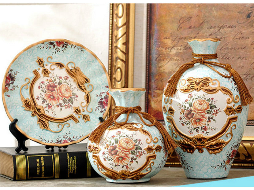 Light blue floral ceramic vase set with gold rim, three sizes.