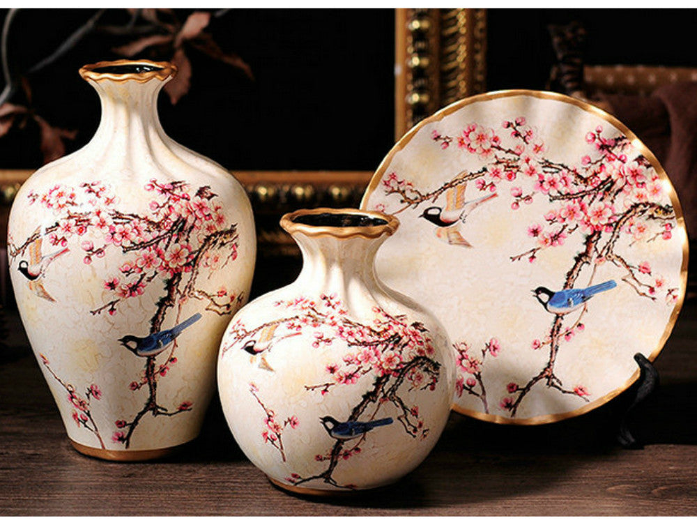Off white ceramic vase set with golden rim, featuring cherry blossom meadow design.