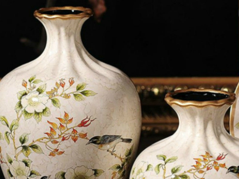 Off white ceramic vase set with hand-painted finch and floral design.