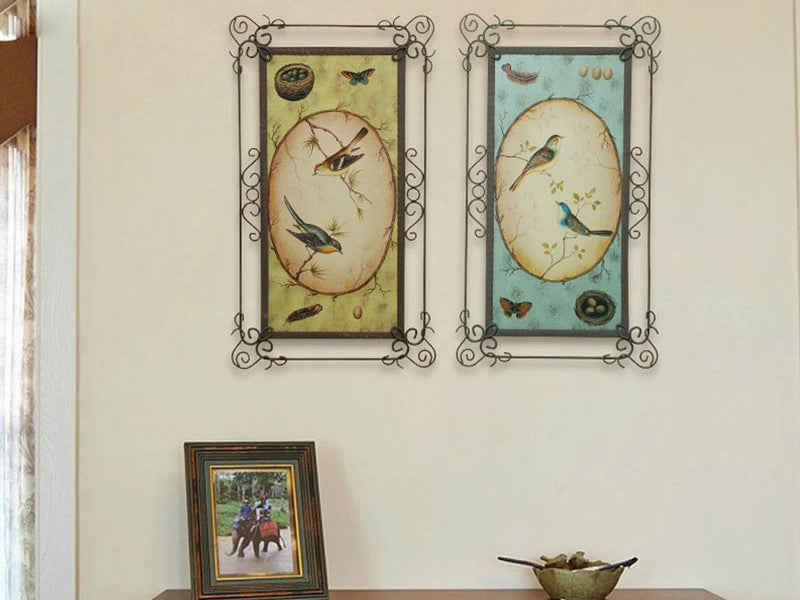 Two blue and yellow metal lover birds wall art pieces.