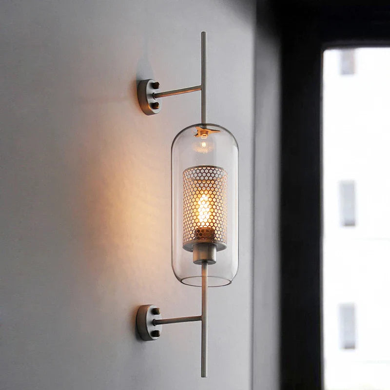 Retro industrial glass ball wall lamp with bronze finish.