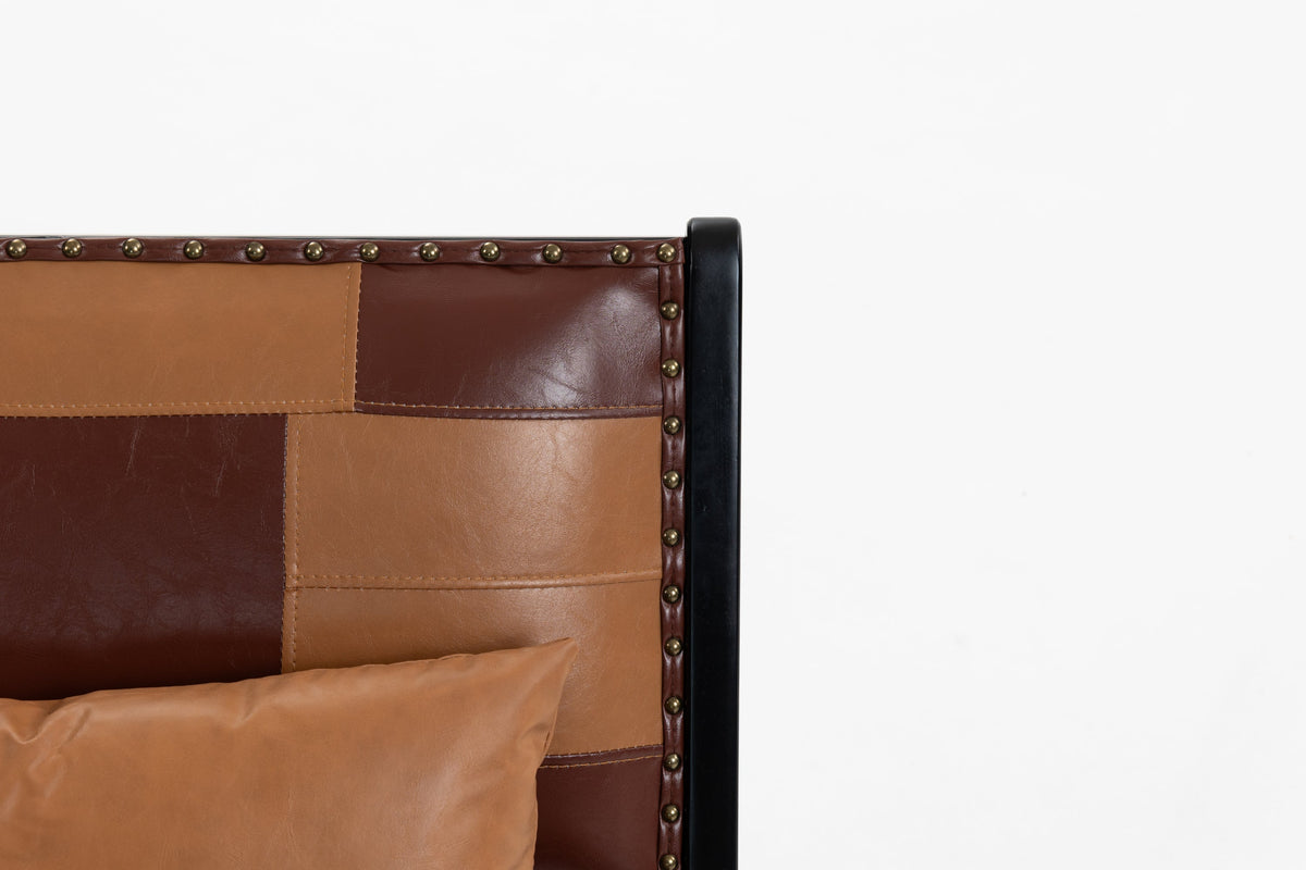 Brown PU leather armchair with modern boho Scandinavian design.