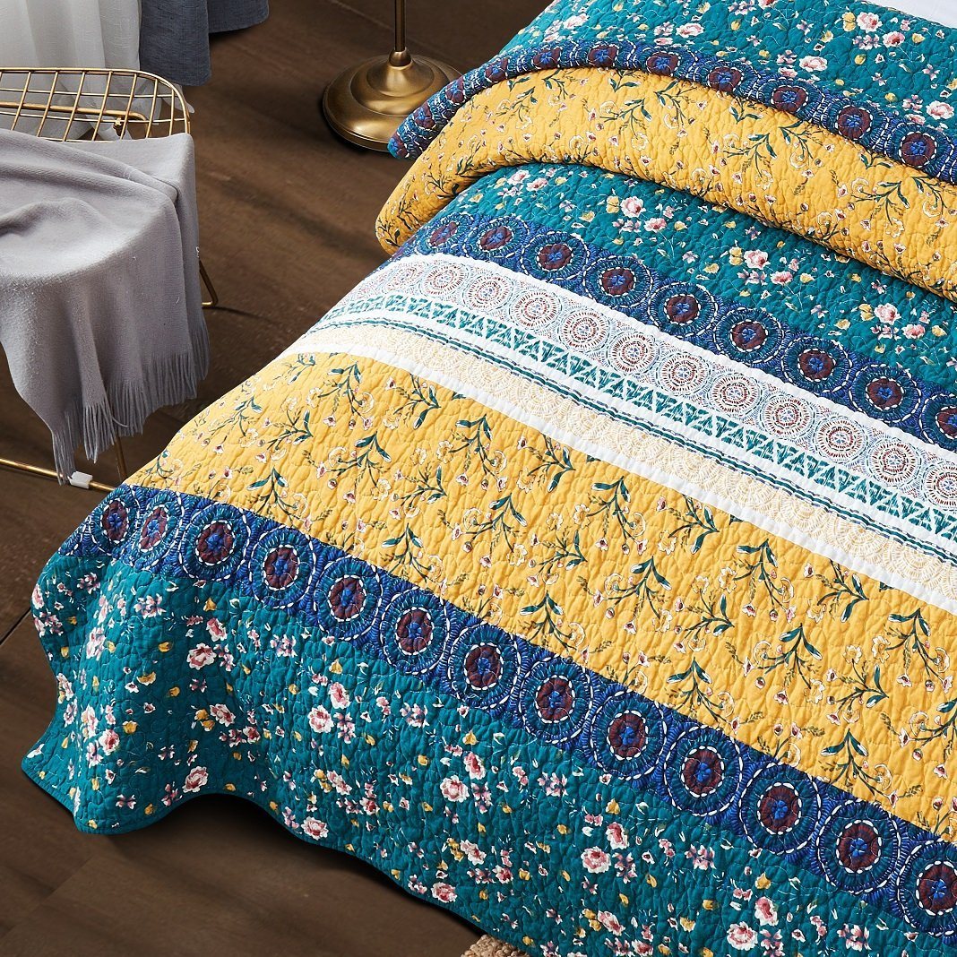 Bohemian floral patchwork bedspread set in gardenia green.