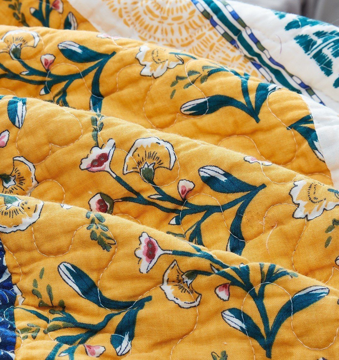 Bohemian patchwork floral gardenia green bedspread set with matching pillow shams.