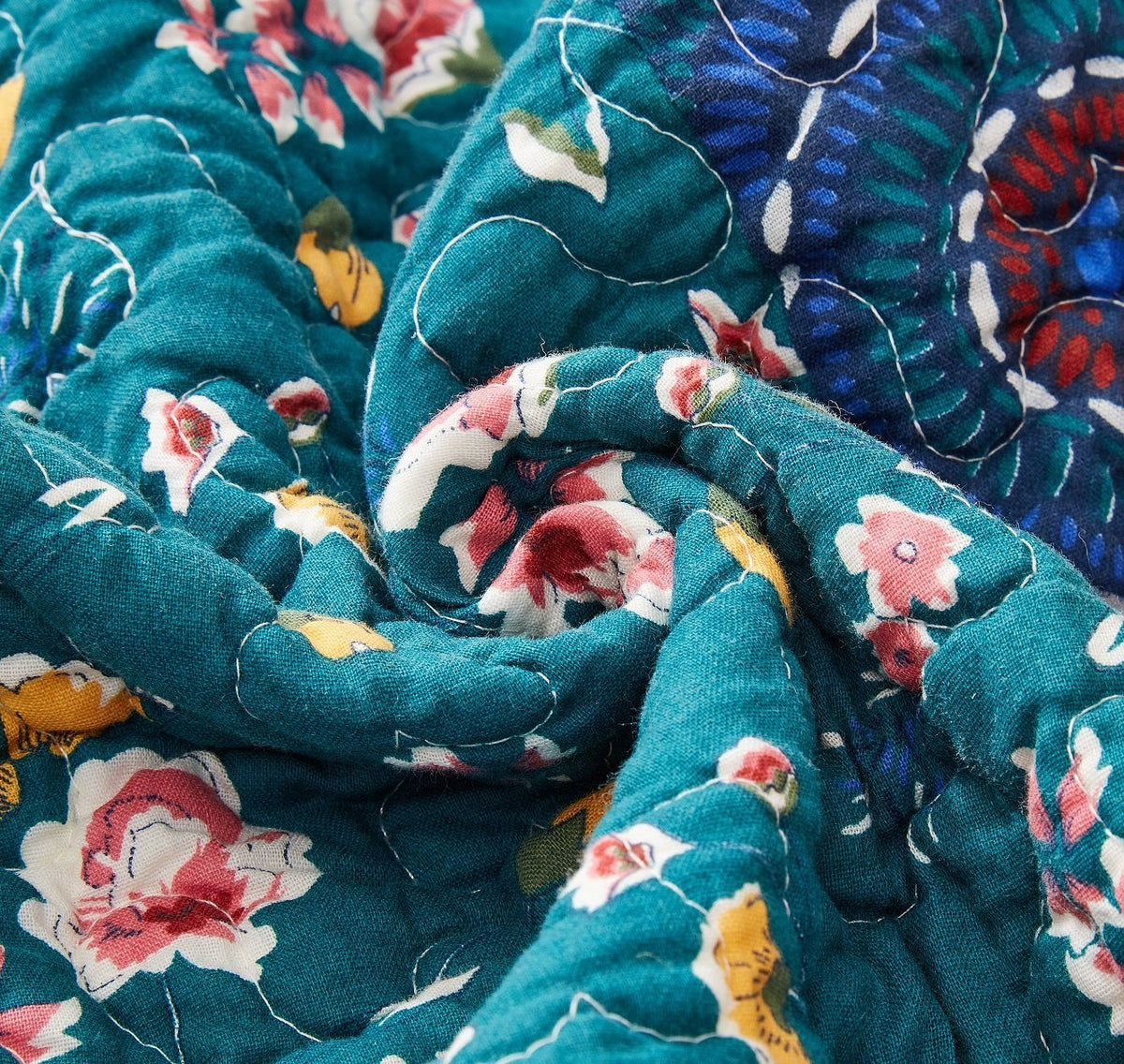 Bohemian floral patchwork gardenia green bedspread set with decorative pillows.
