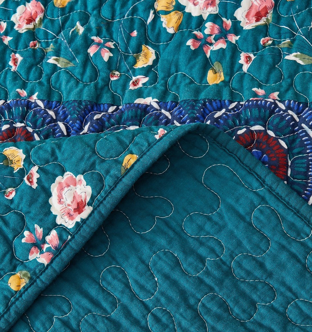 Bohemian patchwork floral gardenia green bedspread set with decorative pillows.