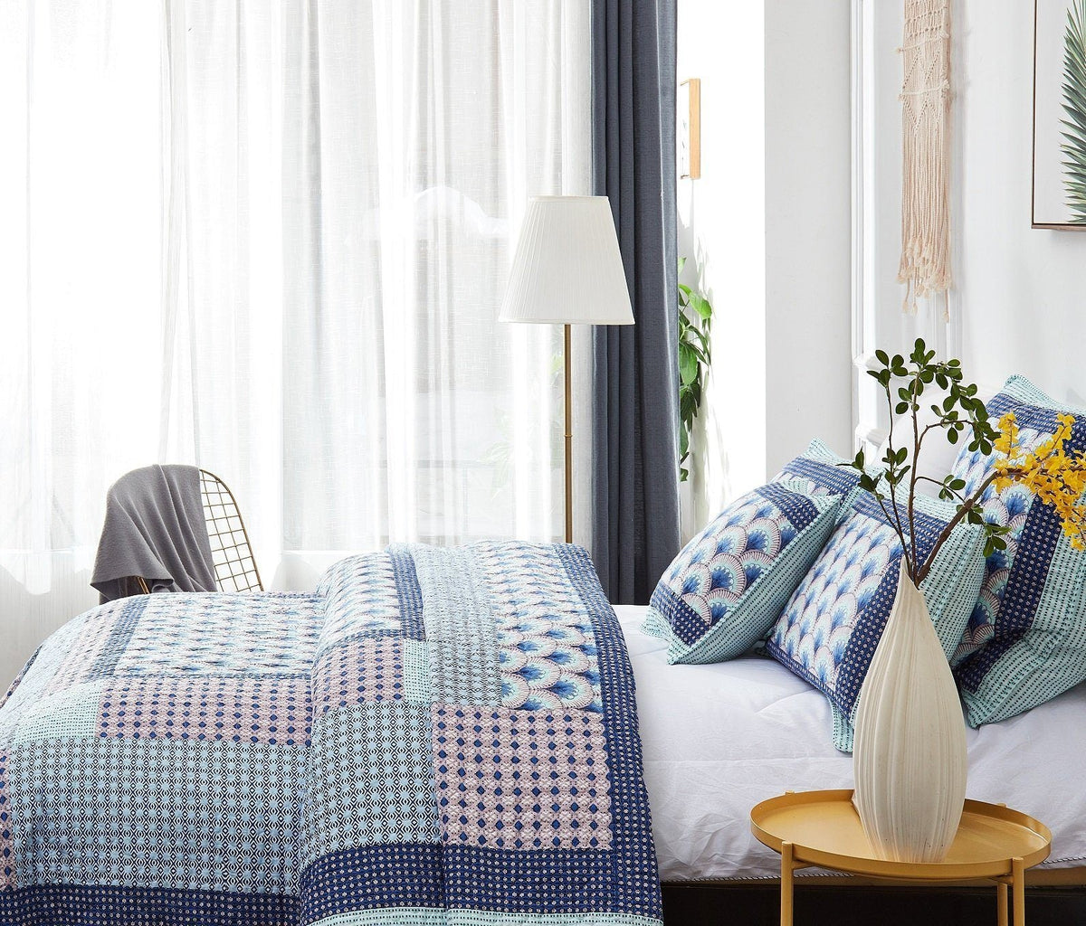 Blue and green Mediterranean patchwork quilted bedspread set.