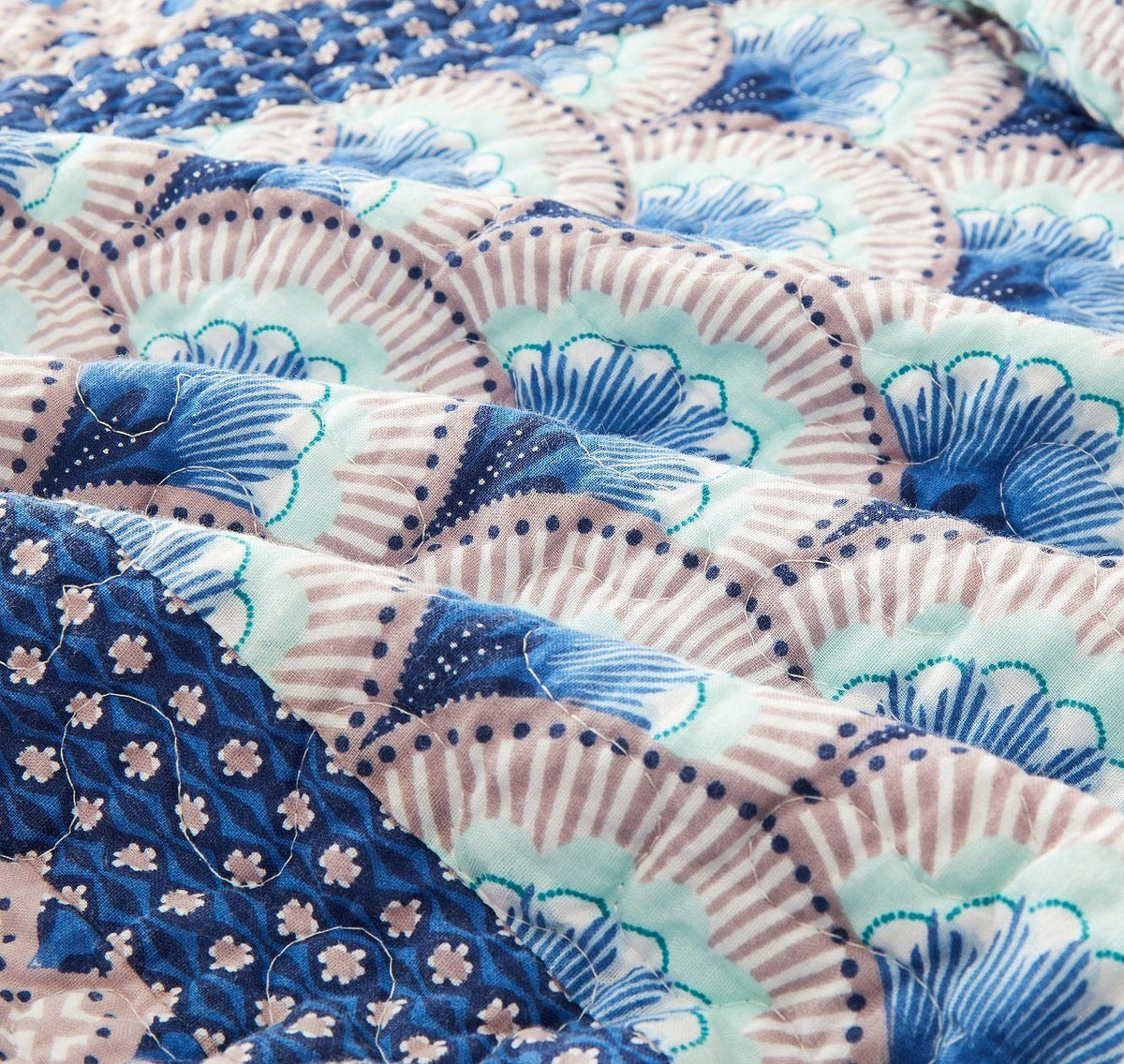 Blue and green Mediterranean patchwork quilted bedspread set.