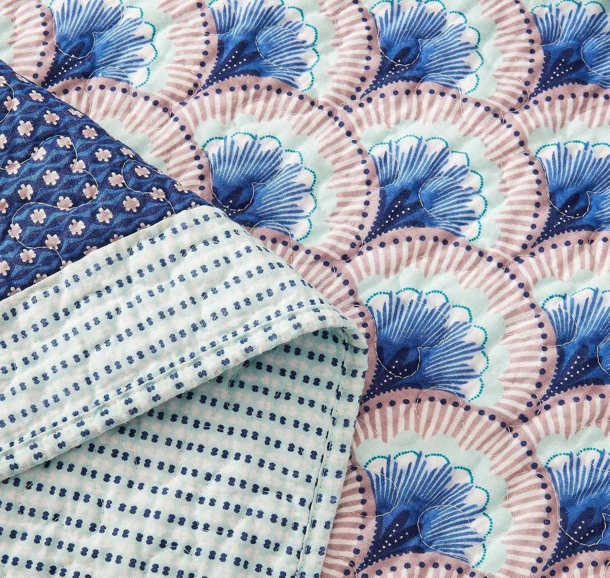 Blue and green Mediterranean patchwork quilted bedspread set.