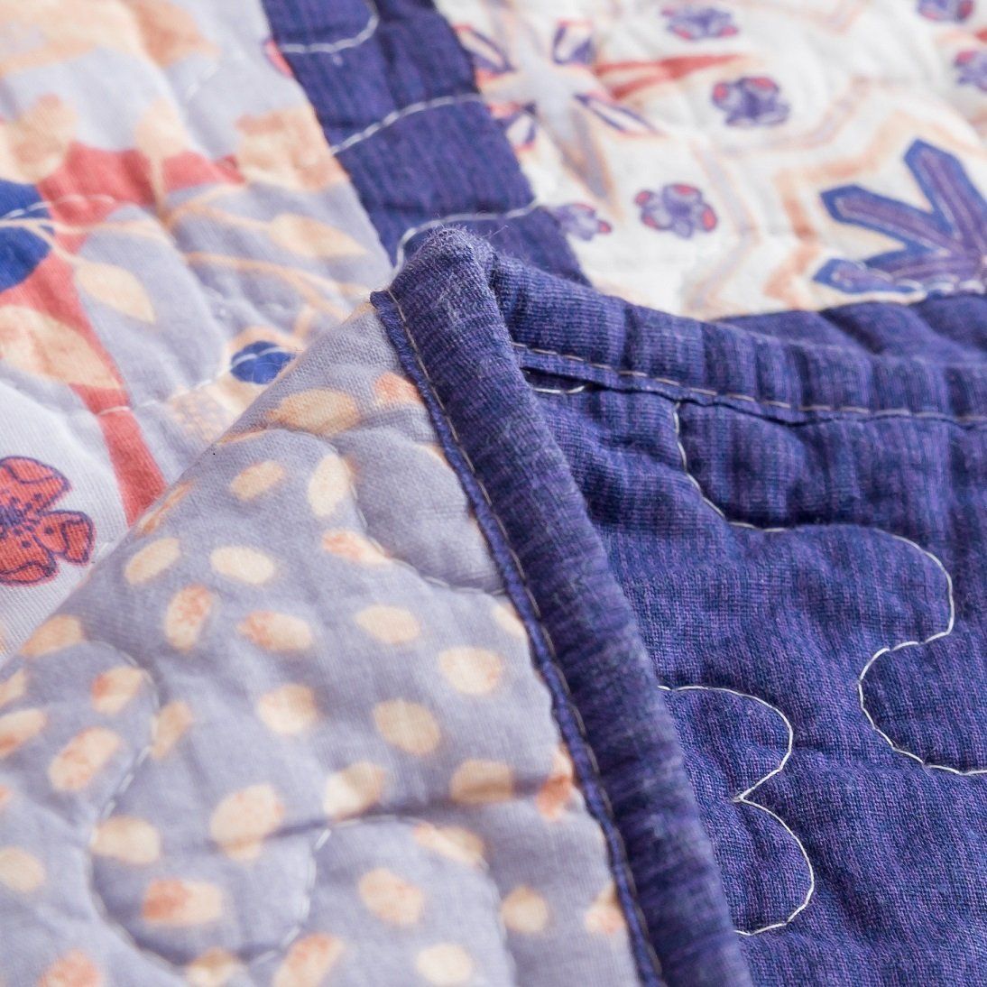 Peachy pink, plum purple floral patchwork quilted bedspread set with pillow shams.