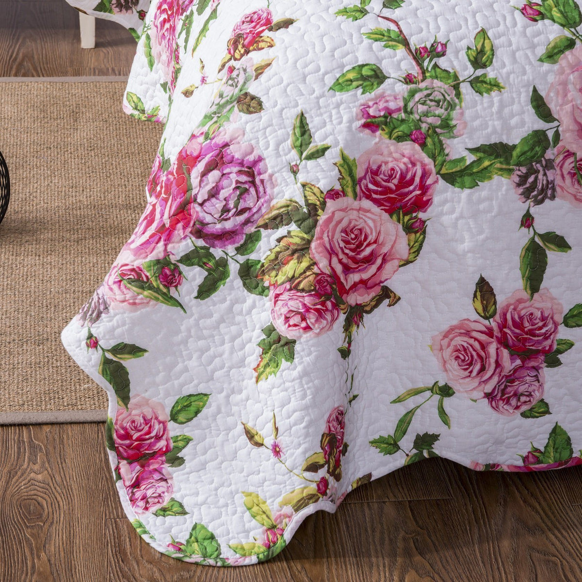 Pink floral quilted bedspread set with scalloped edges and romantic roses.