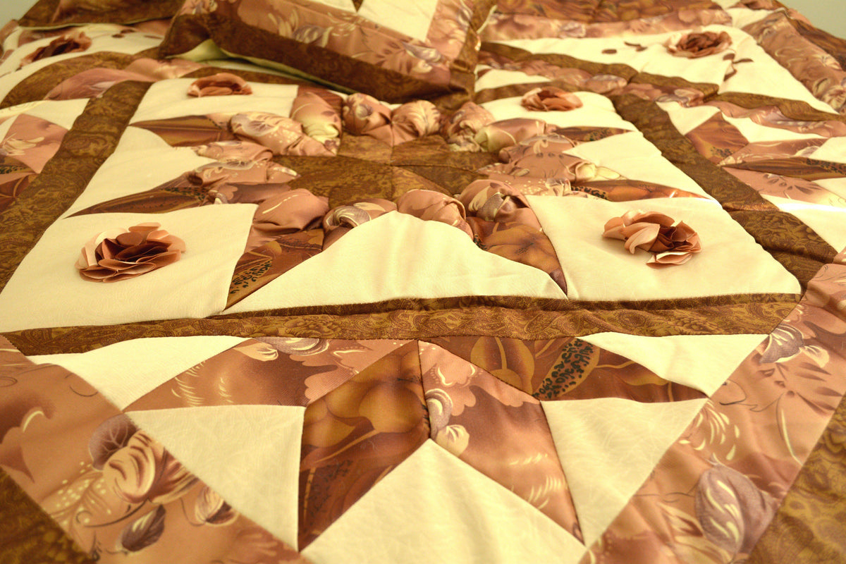 Brown and beige floral stars comforter set with ruffles.