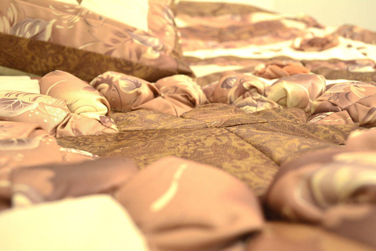 Brown and beige floral comforter set with diamond pattern, stars, and ruffles.
