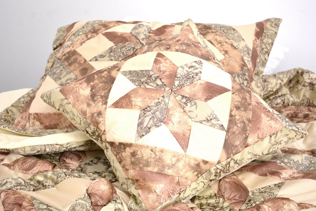 Rustic camo earthy floral beige green comforter set, close-up texture detail.