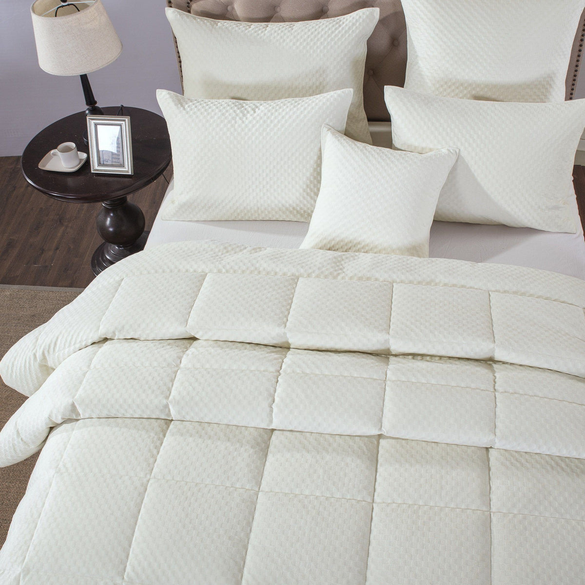 Ivory white plush velvet comforter set with tufted quilting.
