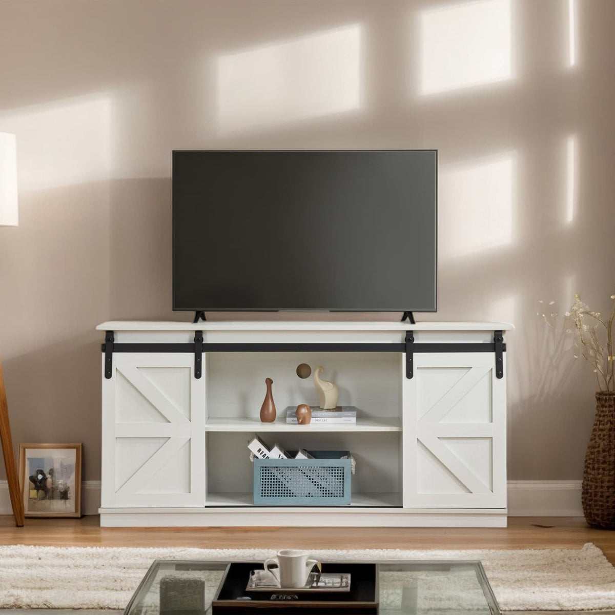 White 58-inch farmhouse TV stand with sliding barn doors and storage.