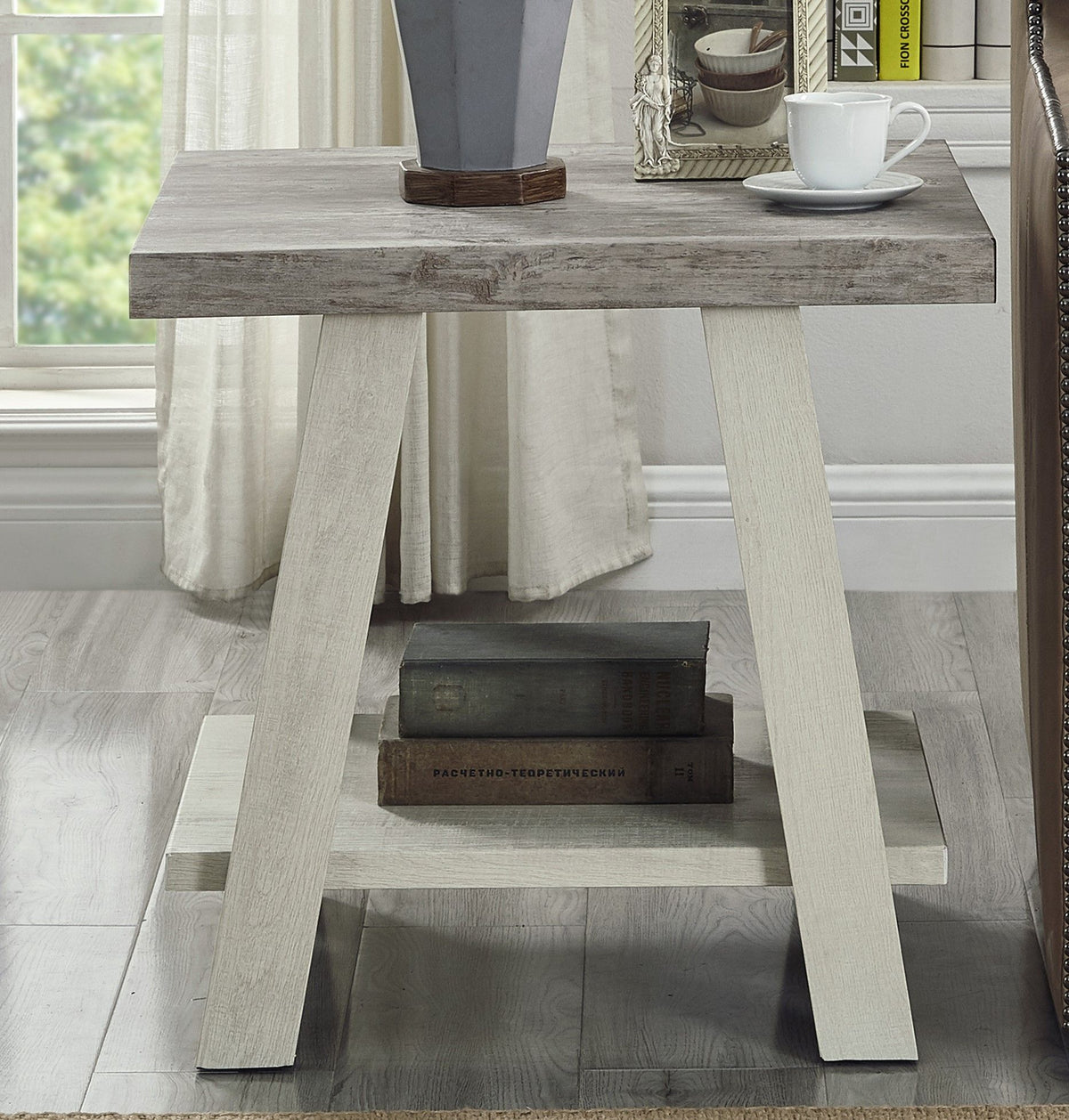 Two-tone wood end table with shelf in weathered gray and beige.