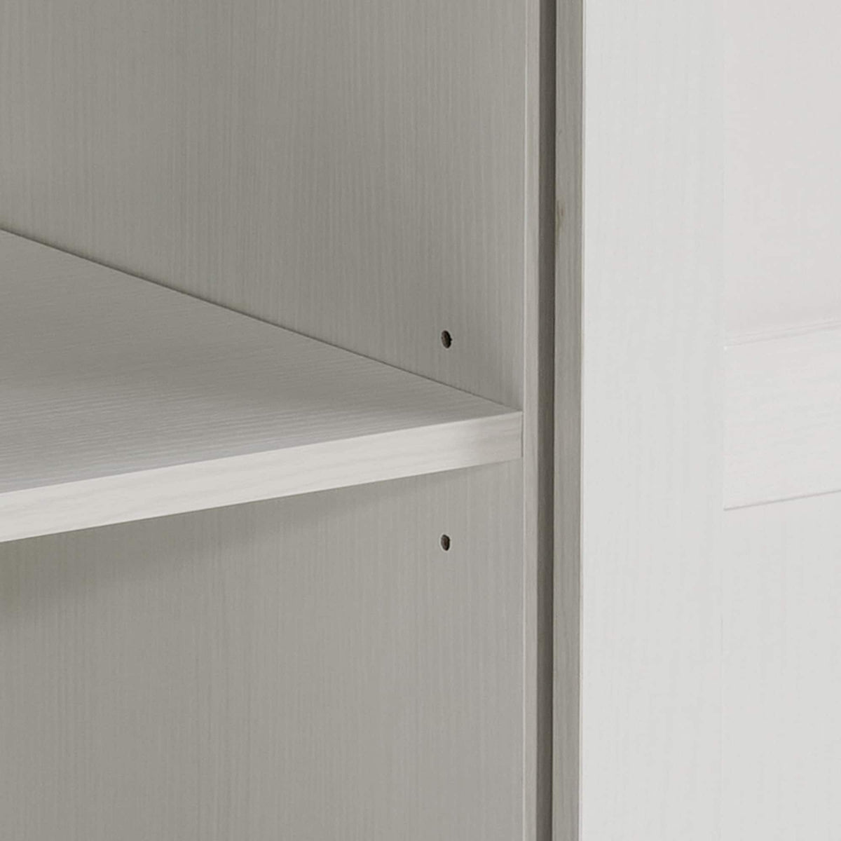 White 58-inch farmhouse TV stand with sliding barn doors and open shelves.