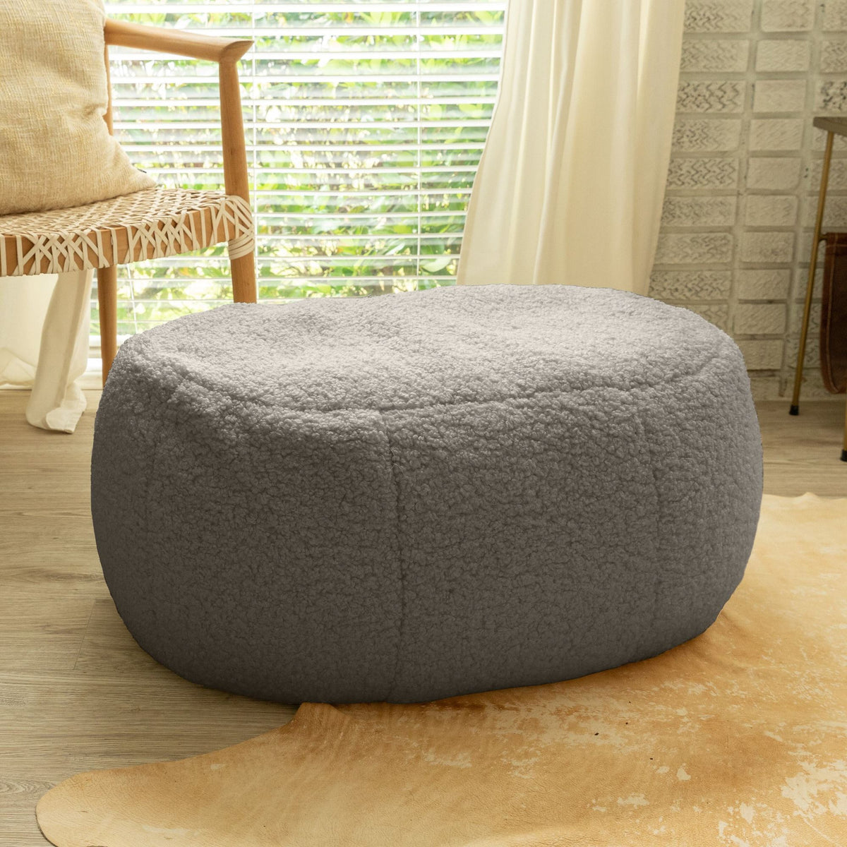 Jaxx Ellis oval ottoman pouf in smoke faux shearling lamb plush