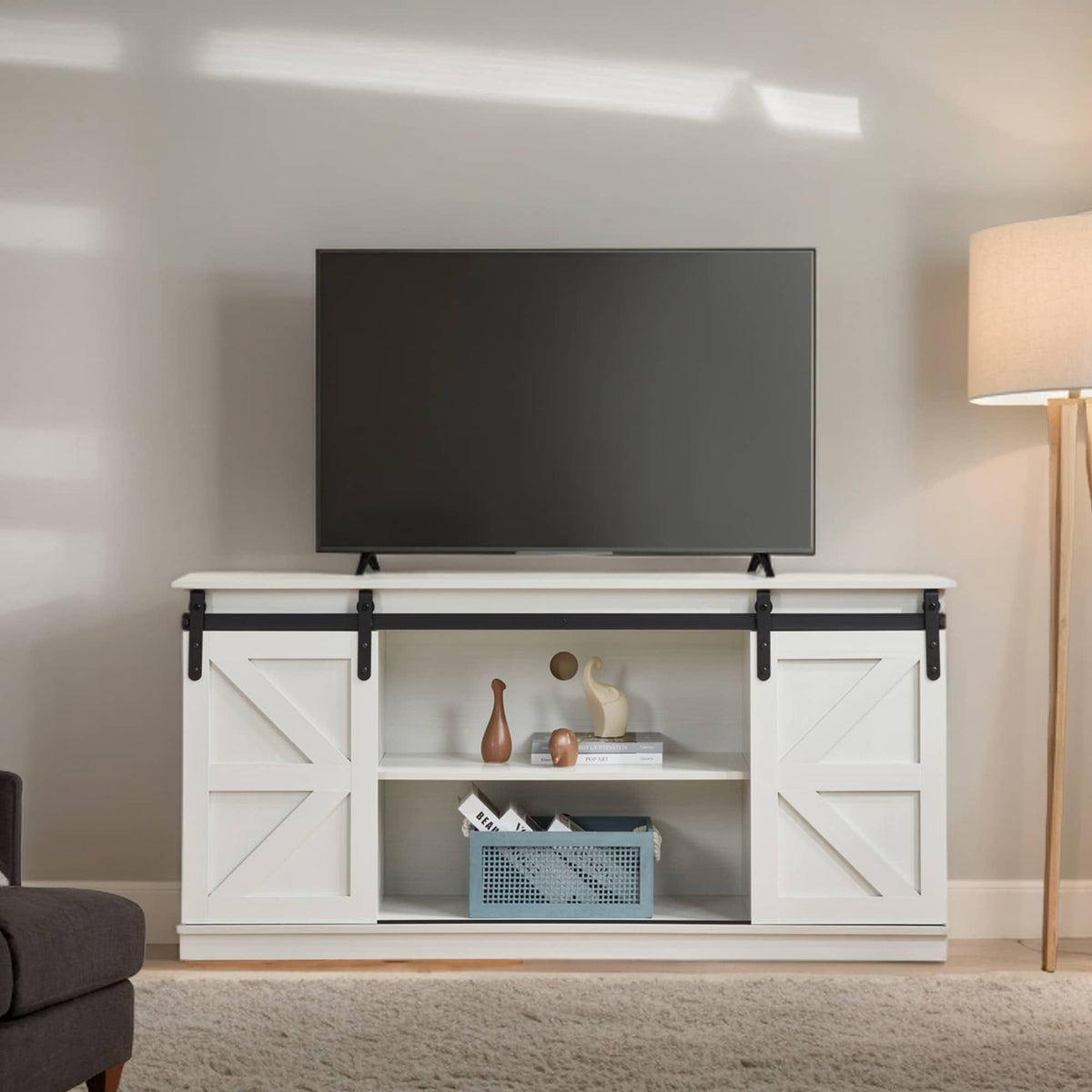 White 58-inch farmhouse TV stand with sliding barn doors and storage.