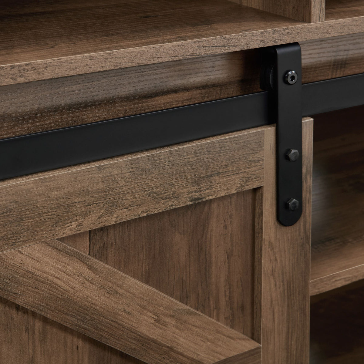 Natural brown farmhouse barn door TV stand with wood storage and entertainment center.