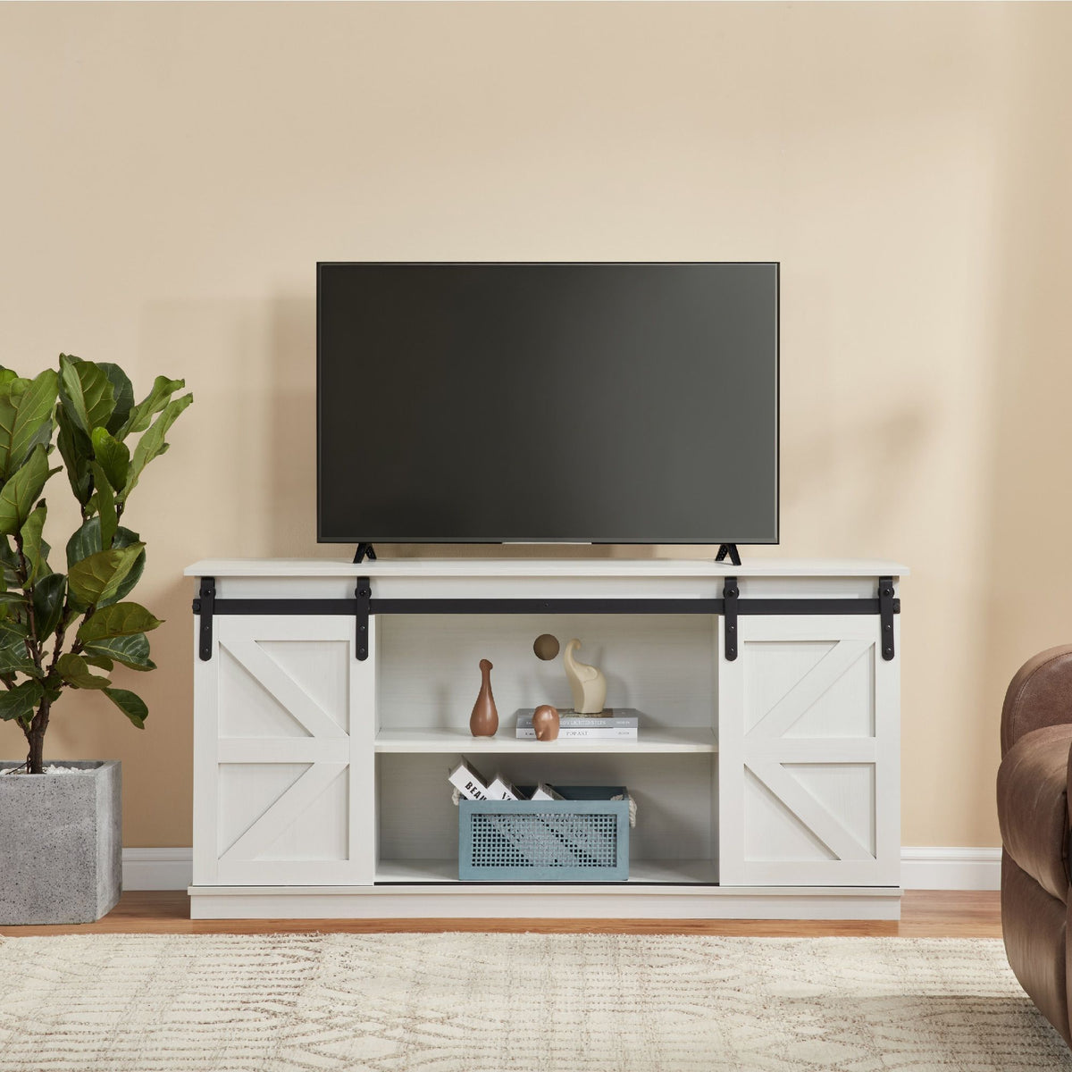 White 58-inch farmhouse TV stand with sliding barn doors and ample storage.