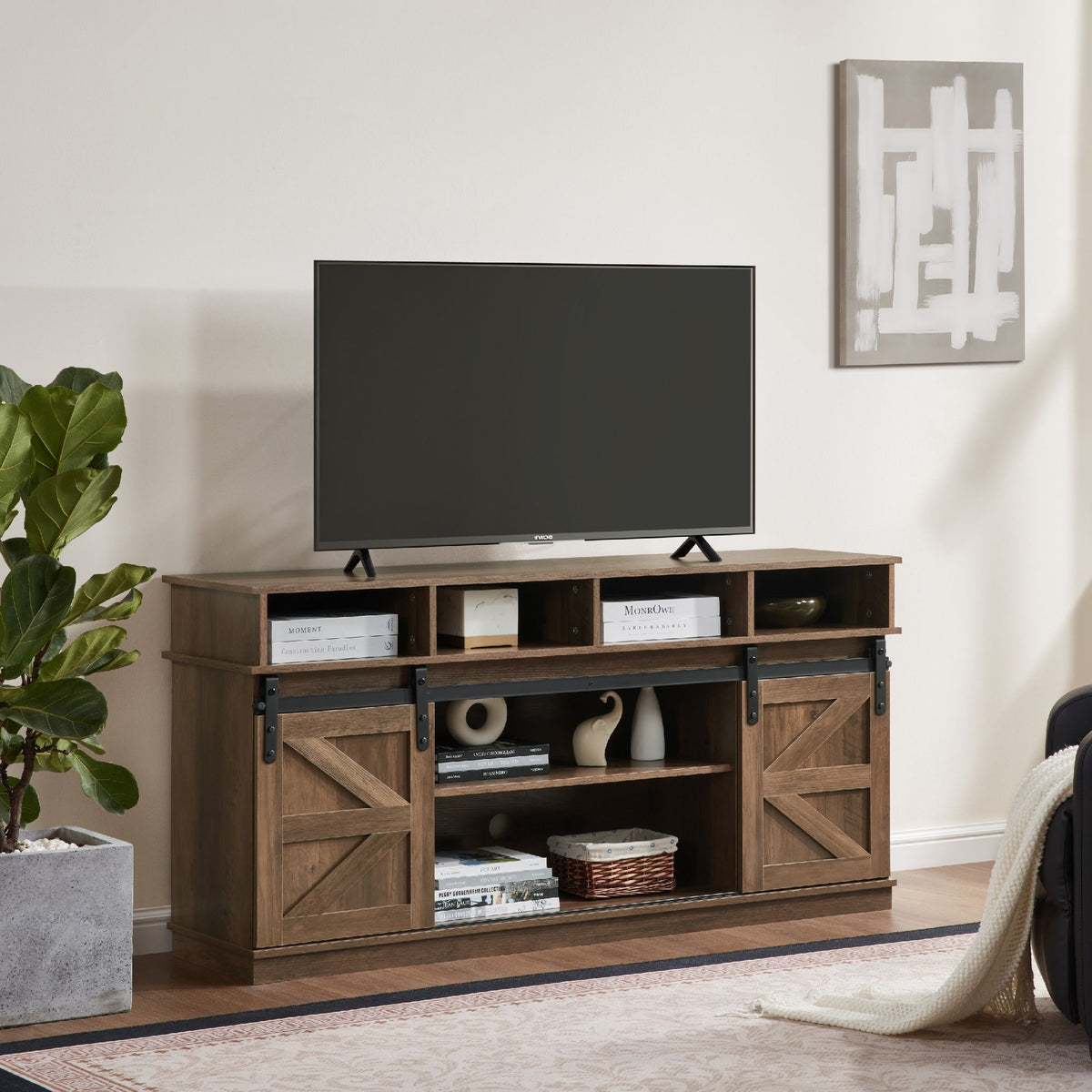 Natural brown farmhouse barn door TV stand with wood storage and entertainment center