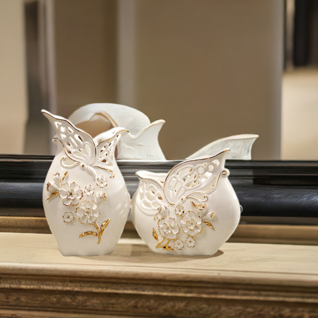 Set of 2 gold-accented porcelain vases with basket weave and pinched flower details.