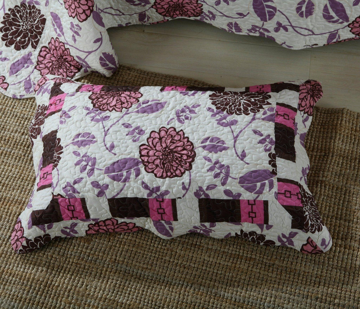 Bohemian purple floral bedspread set with pink and brown accents.