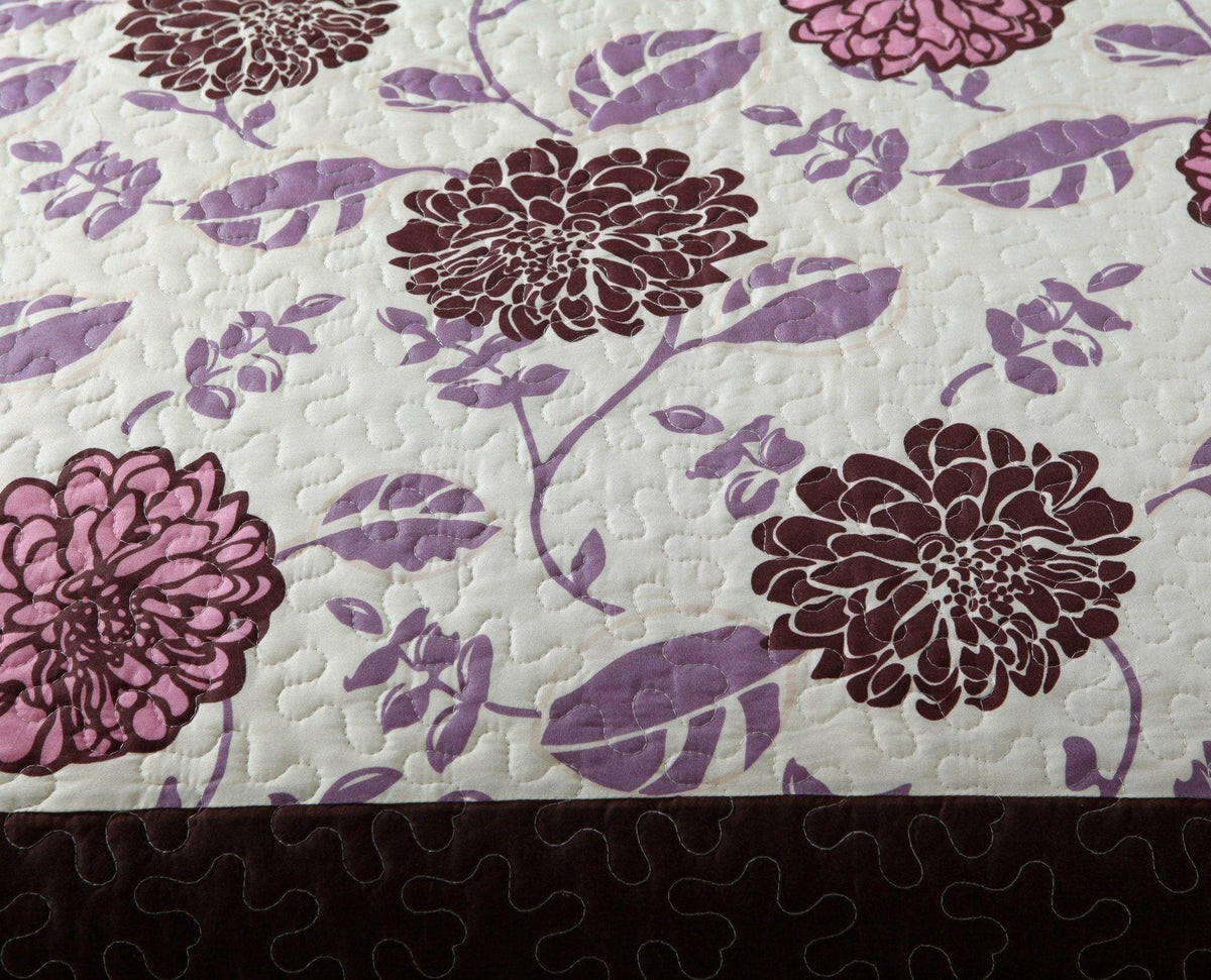 Bohemian floral bedspread set in purple, pink, and brown blooms.