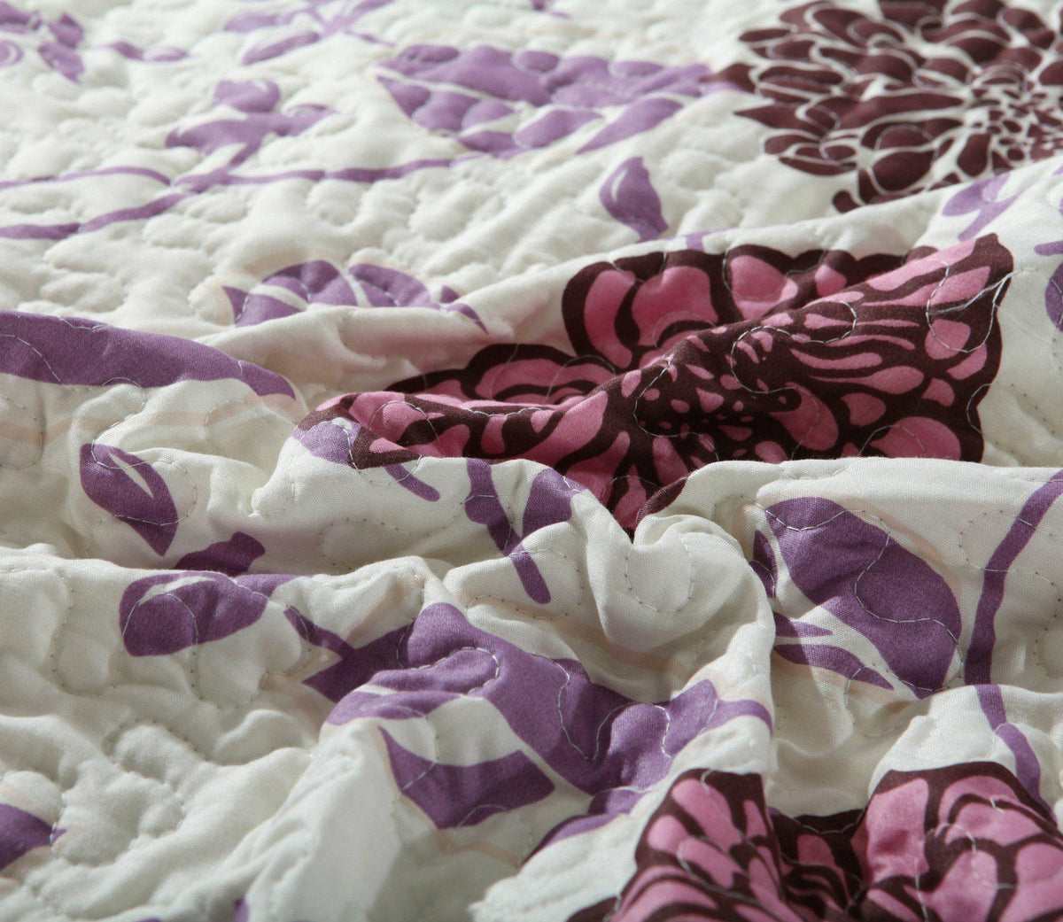 Bohemian purple floral bedspread set with pink and brown accents.