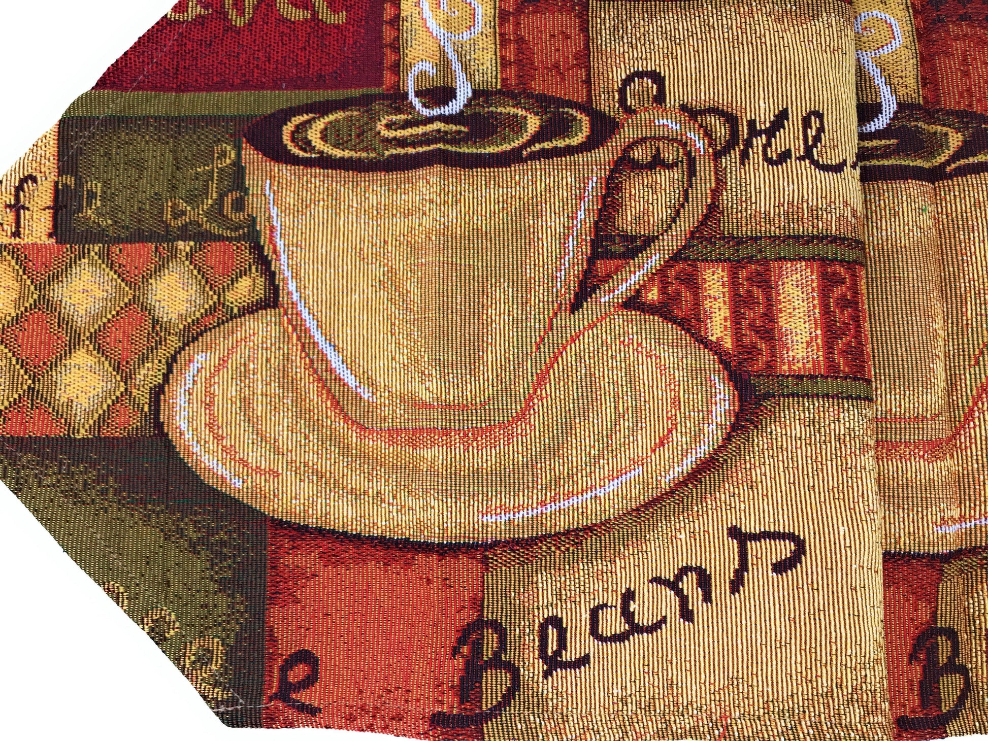 Brown tapestry table runner with latte art coffee cup and golden tassels.