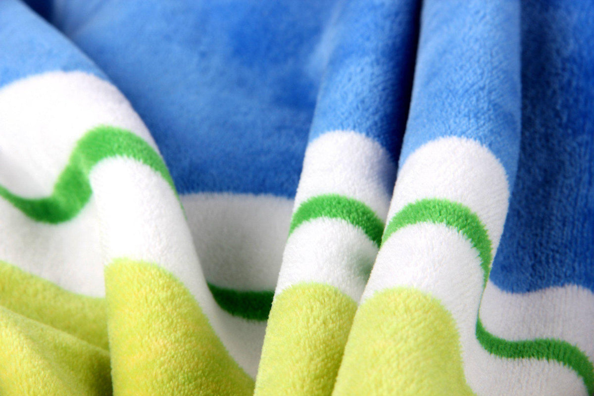 Rainbow striped plush fleece throw blanket, reversible with solid color side.